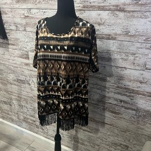 Notations 1 X blouse with fringe at bottom.